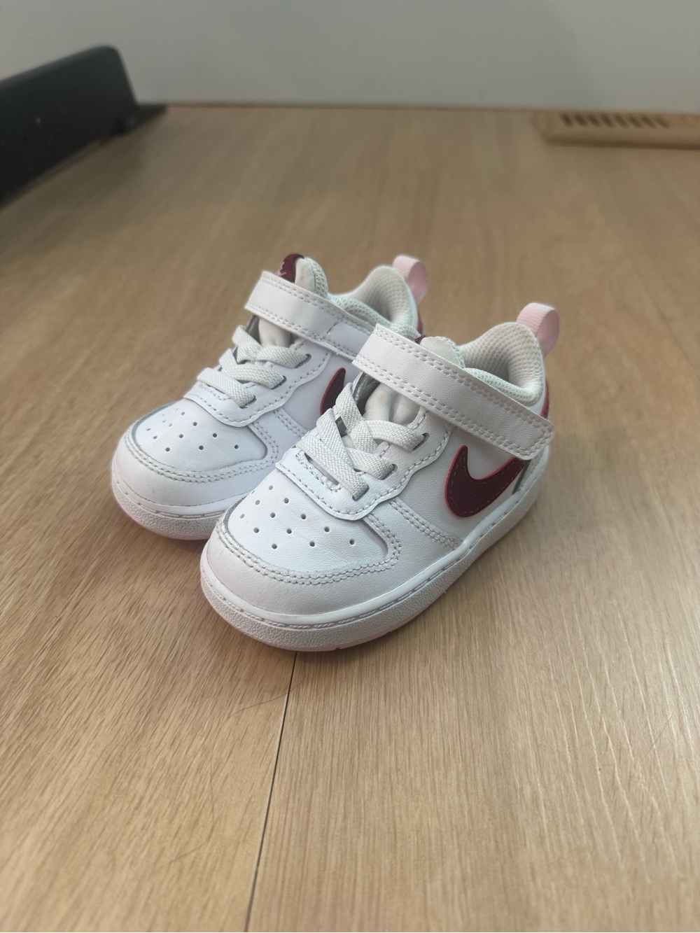 Nike White Kids Sneakers with Pink Accents and Maroon Swoosh